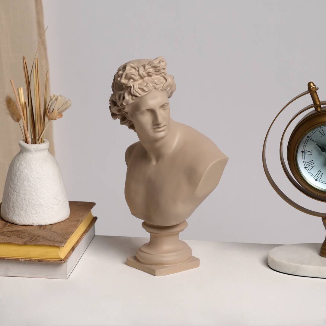 beige classical-style bust sculpture of a man