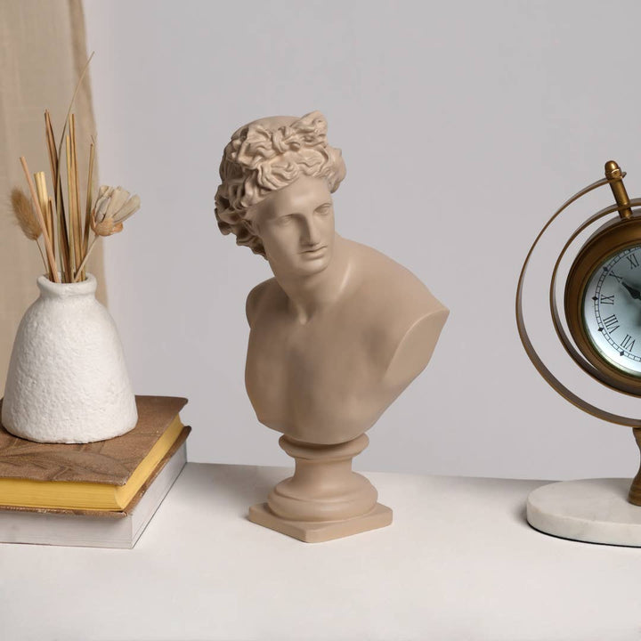 beige classical-style bust sculpture of a man